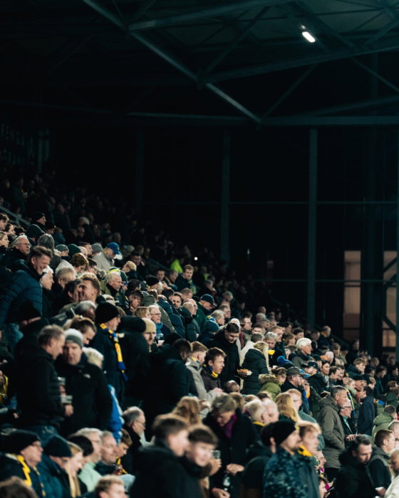 Supporters op een volle tribune